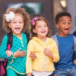 A group of laughing preschoolers