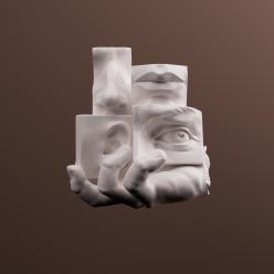 Sculpture of an eye, nose, mouth, and an ear.